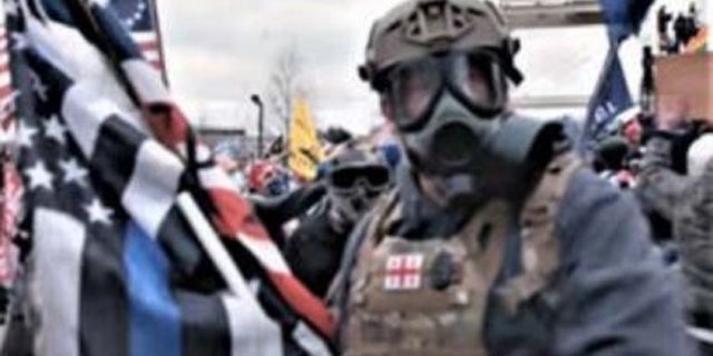The FBI said McKellop was seen holding a "thin blue line" flag.