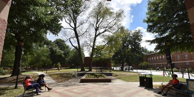 Students sit on the campus of Spelman College in Atlanta. (Hyosub Shin/Atlanta Journal-Constitution via AP, File)/Atlanta Journal-Constitution via AP)