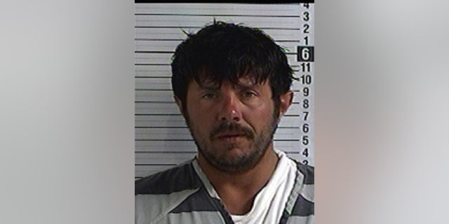 Christopher Cox, 37, faces a murder charge in the killing of a 14-year-old boy and wounding another, authorities said.