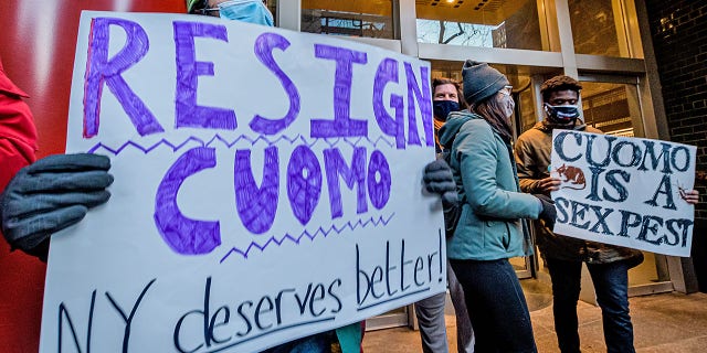 MANHATTAN, NEW YORK, UNITED STATES - 2021/03/02: Participant seen holding a sign at the protest. New Yorkers held a rally outside Governor Cuomo's offices in Manhattan calling for his immediate resignation from office after the revelations of alleged mishandling the COVID-19 pandemic by purposefully withholding information from the public and the federal government, abuses of power, stories of the toxic workplace culture and two allegations of sexual abuse. (Photo by Erik McGregor/LightRocket via Getty Images)