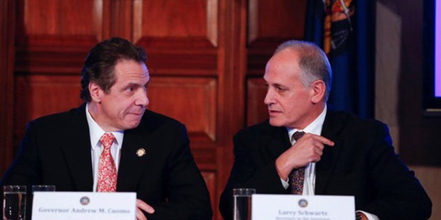 Gov. Andrew Cuomo and longtime friend Larry Schwartz (Source: AP)