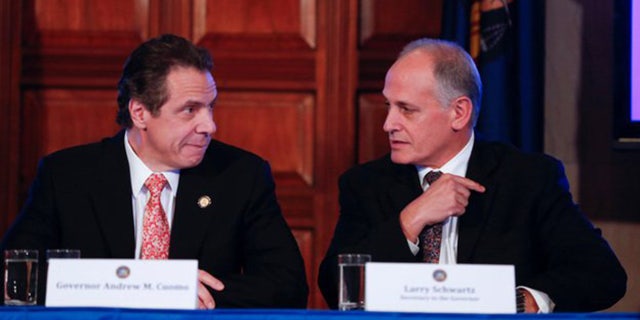 Gov. Andrew Cuomo and longtime friend Larry Schwartz (Source: AP)