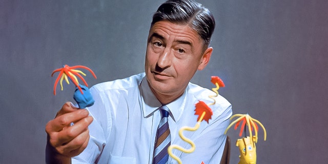 Children's book author/illustrator Theodor Seuss Geisel poses with models of some of the characters he has created, circa 1959.