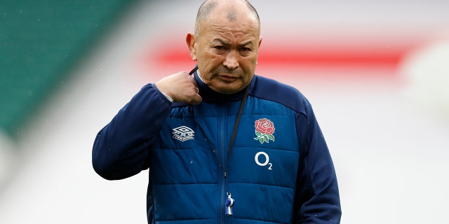 England's head coach Eddie Jones watches his players warm up before the Six Nations rugby union match between England and France at Twickenham Stadium, London, Saturday, March 13, 2021. (AP Photo/Alastair Grant)