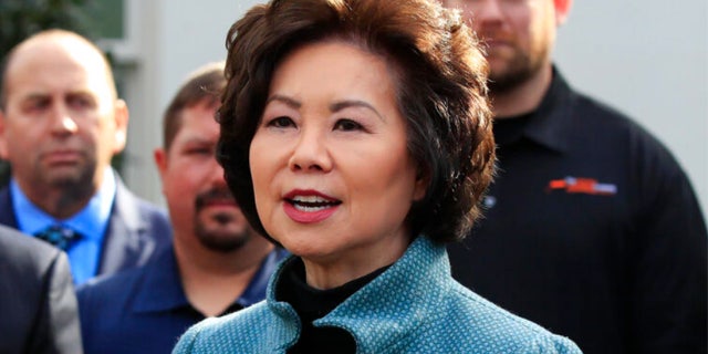 Transportation Secretary Elaine Chao speaks to reporters outside the West Wing of the White House.