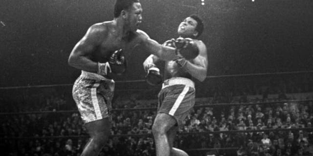 FILE - Joe Frazier hits Muhammad Ali with a left during the 15th round of their heavyweight title fight at New York's Madison Square Garden, in this March 8, 1971, file photo. Frazier was a relentless puncher filled with rage toward a fighter who couldn’t help but belittle him.(AP Photo/File)