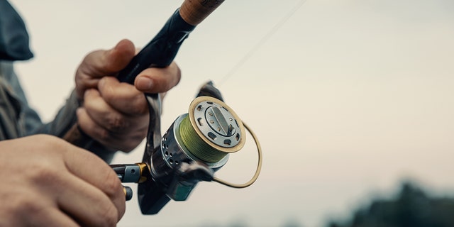 Close-up photo of a man fishing