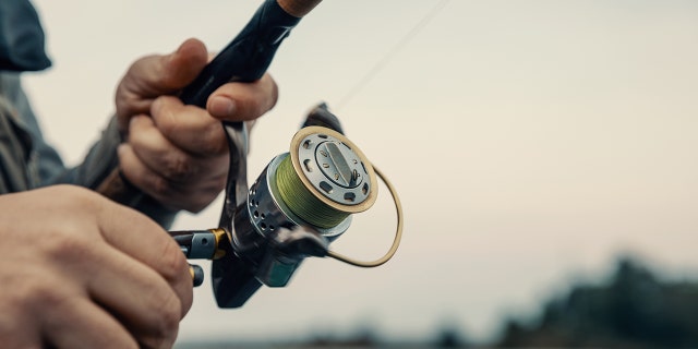 Close-up photo of a man fishing