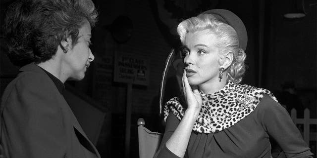 Actress Marilyn Monroe and her acting coach Natasha Lytess on the set of the film "Gentlemen Prefer Blondes' in December 1952 in Los Angeles, California.