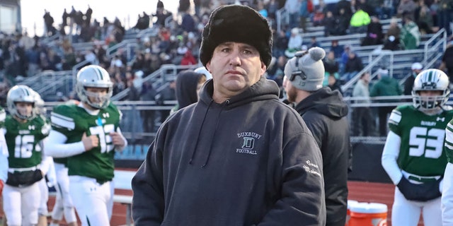 Duxbury High head coach Dave Maimaron on the sidelines against Tewksbury High during the MIAA Division 3 football semifinal at Xaverian Brothers High in Westwood, MA on Nov. 23, 2019. (Photo by Matthew J. Lee/The Boston Globe via Getty Images)