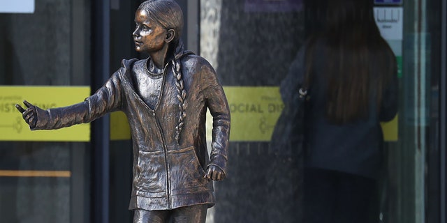 A statue of climate change activist Greta Thunberg has been installed outside the University of Winchester's West Down Centre in Winchester, Hampshire on Tuesday, March 30, 2021. (Photo by Andrew Matthews/PA Images via Getty Images)