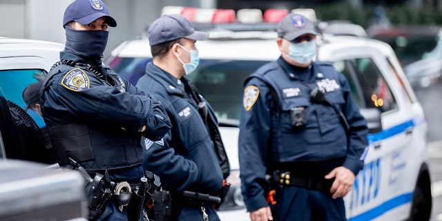 NYPD officers wear masks in Times Square. 