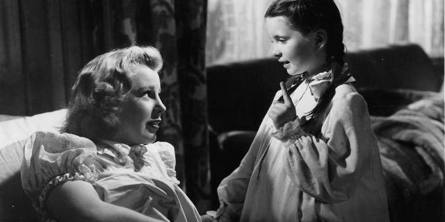 Margaret O'Brien (right) with June Allyson in a scene from the film 'Music For Millions', 1944.