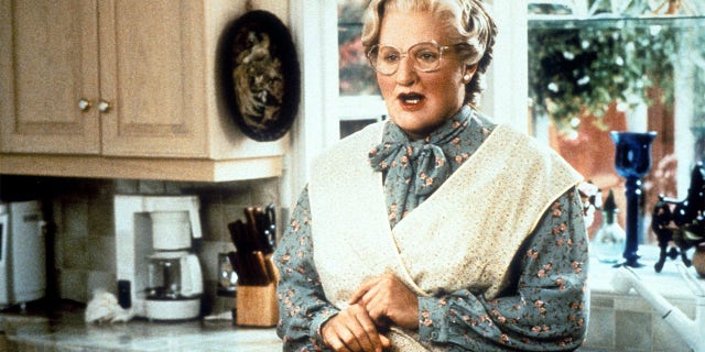 Robin Williams in the kitchen in a scene from the film 'Mrs. Doubtfire', 1993.