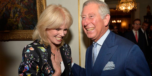 LONDON - MAY 1: Prince Charles, Prince of Wales greets actress Joanna Lumley as he hosts a reception to mark the 60th anniversary of the charity 'Samaritans', at Clarence House on May 1, 2013 in London.
