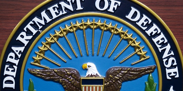 The US Department of Defense seal on the lectern in the media briefing room at the Pentagon Dec. 12, 2013, in Washington, D.C.    