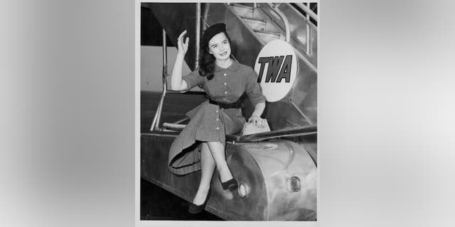Actress Margaret O'Brien posing next to an airplane at Idlewild Airport, New York, circa 1951.