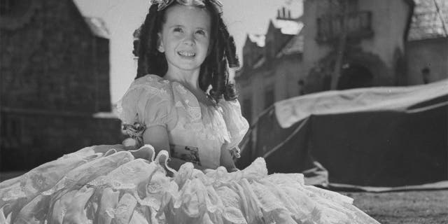 Child film actress Margaret O'Brien on set.