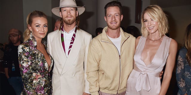 (L-R) Brittney Kelley, Brian Kelley and Tyler Hubbard of Florida Georgia Line, and Hayley Hubbard attend the 2017 CMT Music Awards at the Music City Center on June 7, 2017, in Nashville, Tennessee.