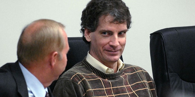 Coeur d'Alene, UNITED STATES: Joseph Edward Duncan III (R), listens to his Public Defender John Adams (L), during a plea agreement and sentencing hearing in the court room of the Kootenai County Jail 16 October, 2006 in Coeur d' Alene, Idaho. AFP PHOTO/POOL/Kathy Plonka (Photo credit should read KATHY PLONKA/AFP via Getty Images)