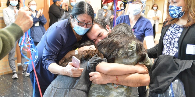 The emotional moment on Tuesday was celebrated by staff who helped care for him during his stay.