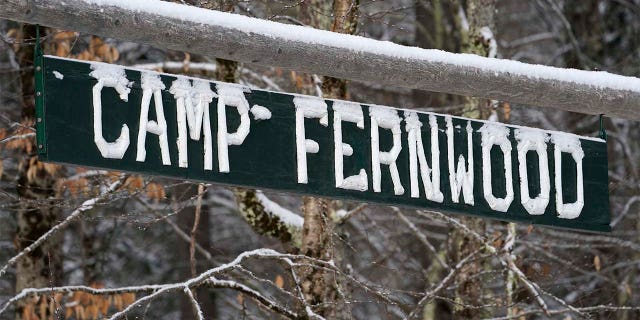A sign is displayed at the entrance to Camp Fernwood, a summer camp for girls, Saturday, Feb. 20, 2021, in Poland, Maine. (AP Photo/Robert F. Bukaty)