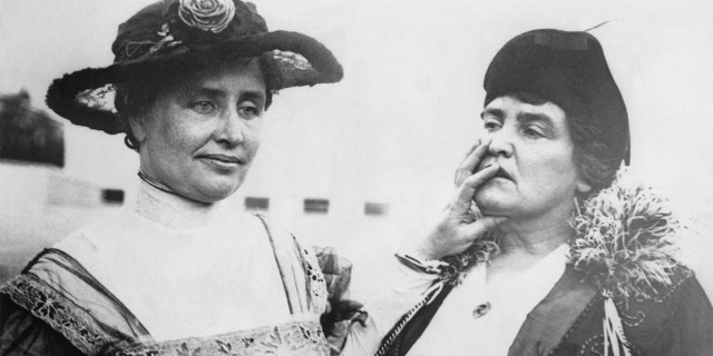 Helen Keller stands with her teacher, Anne Sullivan in 1915