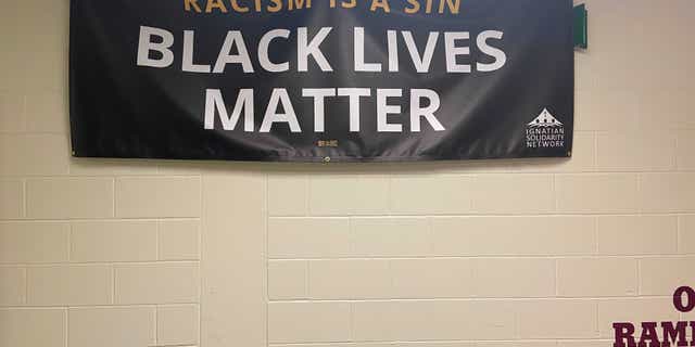 A Black Lives Matter banner that hangs in a hallway at Loyola Academy.