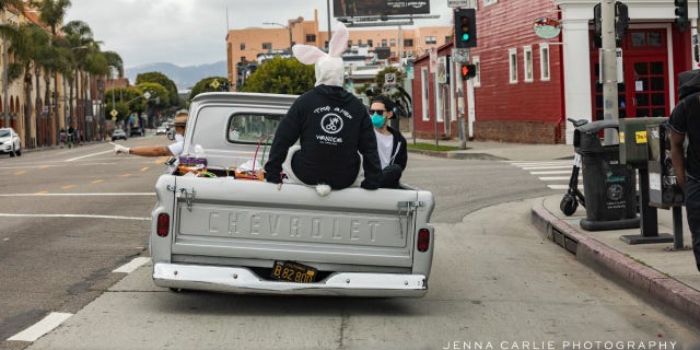Celebrity men's groomer Jason Schneidman and Blake Levy giving out Easter baskets full of supplies to the homeless in Venice, California.