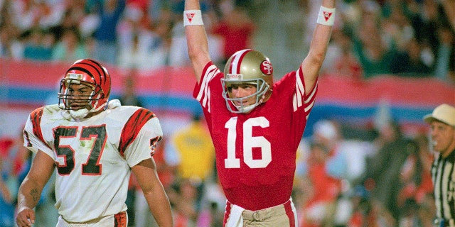 49ers quarterback Joe Montana celebrates after throwing a touchdown pass.