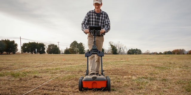 Geophysicist Dr. Timothy J. Horsley conducting the ground-penetrating radar survey (Credit: Historic St. Mary’s City)