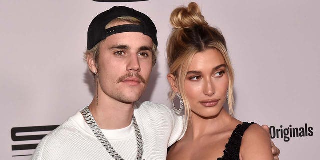Justin Bieber and Hailey Baldwin got matching peach tattoos in honor of his history-making single 'Peaches.' (Photo by Alberto E. Rodriguez/Getty Images)