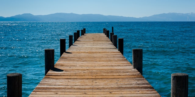 A couple lost the bride's wedding ring during their recent ceremony at Lake Tahoe, when it fell into the lake between the cracks of the dock they were standing on.