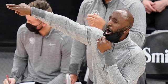 FILE - In this Friday, Jan. 15, 2021, file photo, Atlanta Hawks coach Lloyd Pierce shouts to the team during the second half of an NBA basketball game against the Utah Jazz in Salt Lake City. (AP Photo/Rick Bowmer, File)