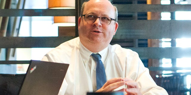 Attorney Marc Elias preps with attorneys Roopali Desai (far left), Sarah Gonski (left) and Amanda Callais on Wednesday, Aug. 3, 2016, before the hearing for his lawsuit against Arizona over voting rights. Elias was the general counsel for the Hillary Clinton campaign. (Photo by David Jolkovski for The Washington Post via Getty Images)