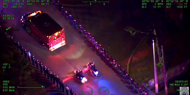 Officer Madsen receiving a police escort away from the crash scene earlier this morning. (Tampa Police Department)