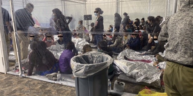 Photo of migrants in a Customs and Border Protection temporary overflow facility in Donna, Texas, being held in clear pens akin to cages. (Office of Rep. Henry Cuellar, D-Texas)