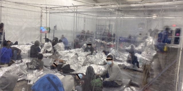 Migrants at a holding facility near the U.S. Southern border being kept in clear enclosures akin to cages. (Office of Rep. Henry Cuellar, D-Texas)