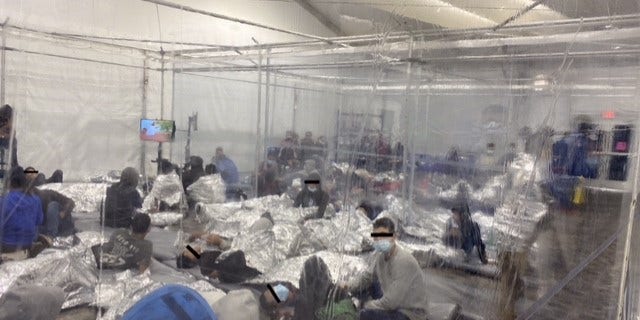 Migrants at a holding facility near the U.S. Southern border being kept in clear enclosures akin to cages. (Office of Rep. Henry Cuellar, D-Texas)