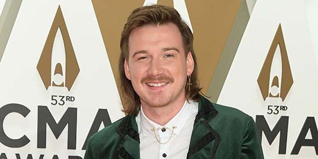 Morgan Wallen has also seen an increase in album sales since the controversy.  (Photo by Jason Kempin / Getty Images)