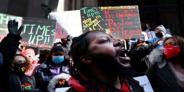 Joseph Saunders and other members of Chicago's St. Sabina Catholic Church rally outside the Archdiocesan Pastoral Center in Chicago demanding resolution of the investigation into allegations against the Rev. Michael Pfleger on Feb. 24. (AP)