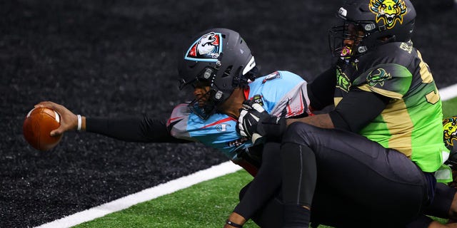 David Pindell #11 of the Glacier Boyz scores a touchdown against Owen Obasuyi #97 of the Beasts during a Fan Controlled Football game at Infinite Energy Arena on February 27, 2021 in Duluth, Georgia. (Photo by Kevin C. Cox/Fan Controlled Football/Getty Images)