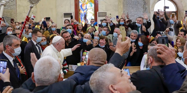 Pope Francis arrives at a meeting with the Qaraqosh community at the Church of the Immaculate Conception, in Qaraqosh, Iraq, Sunday, March 7, 2021.