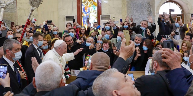 Pope Francis arrives at a meeting with the Qaraqosh community at the Church of the Immaculate Conception, in Qaraqosh, Iraq, Sunday, March 7, 2021. 