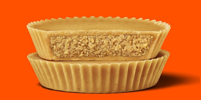 The new candy is similar to an item Reese’s released for limited runs in 2019 and 2020, the Peanut Butter Lovers Cup, which had an extra layer of peanut butter on top of the cup’s candy shell.