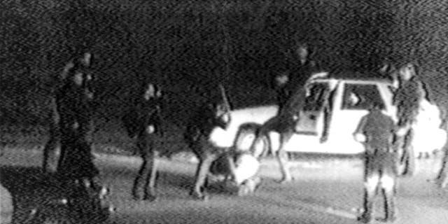 A grainy shot from the 1991 video taken by George Holliday of the police beating of Rodney King. 