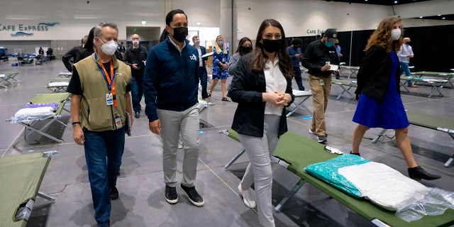 San Diego Mayor Todd Gloria along with other officials are among the group of elected officials who were given a tour of the temporary youth shelter at the center, Saturday, March 27, 2021 in San Diego. (Nelvin C. Cepeda/The San Diego Union-Tribune via AP)