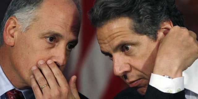 Larry Schwartz, left, a top aide to New York Gov. Andrew Cuomo, resigned this week, according to reports.