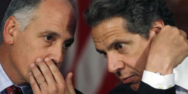 Larry Schwartz, left, a top aide to New York Gov. Andrew Cuomo, resigned this week, according to reports.
