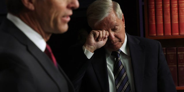 Senate Continues Work On COVID-19 Relief Bill WASHINGTON, DC - MARCH 05: U.S. Minority Whip Sen. John Thune (R-SD) (L) speaks as Sen. Lindsey Graham (R-SC) listens during a news conference at the U.S. Capitol on March 5, 2021 in Washington, DC. The Senate continues to debate the latest COVID-19 relief bill. (Photo by Alex Wong/Getty Images)